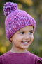 A little girl is shown wearing the Snowball Fight Hat. Shown in Porhinno.